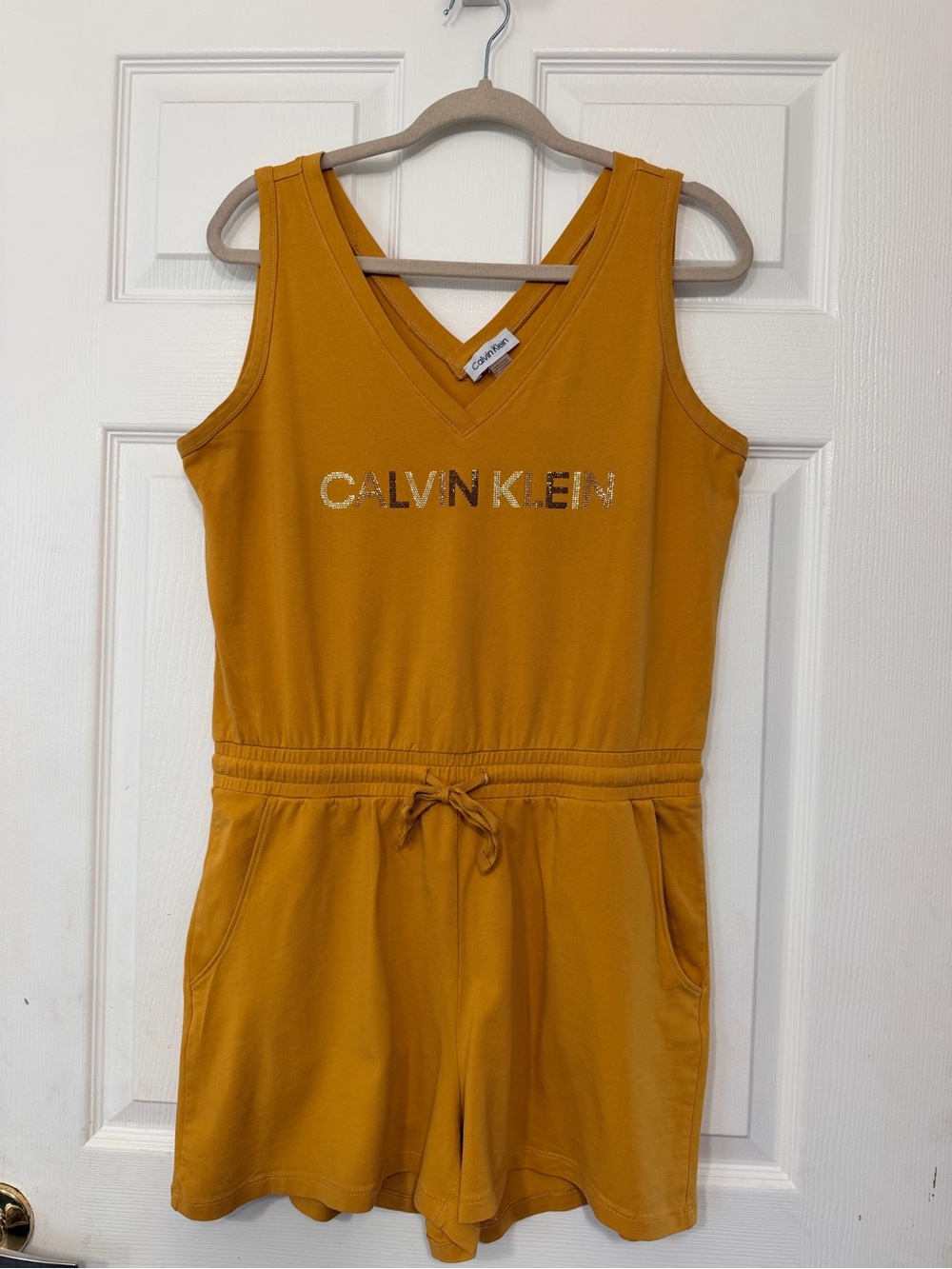 Calvin Klein Mustard Yellow Sleeveless V‑Neck Romper with Logo
